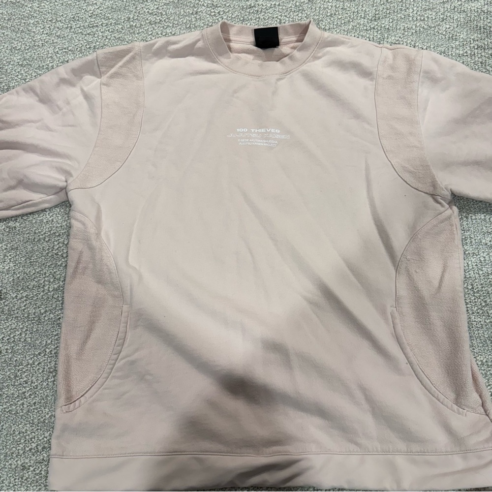 100 Thieves light pink crewneck sweatshirt